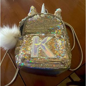 Justice gold sequined unicorn mini backpack letter K. Barely used almost new .